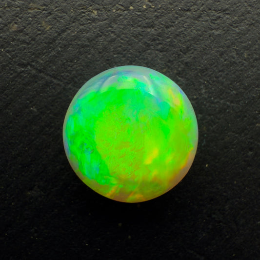 1.1ct Dark Crystal Opal With A Vivid Green Gold Color Palette And Lots Of Depth