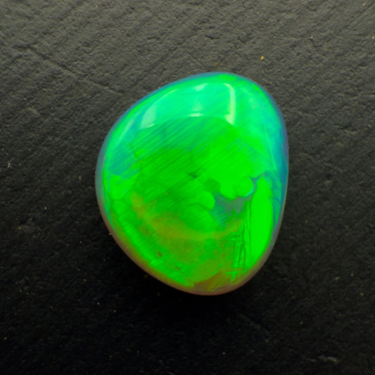 1.3ct Black Crystal Opal With A Brilliant Green Rolling Broadflash Pattern With Undertones Of Blue