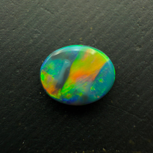 0.63 Black Opal With A Vivid Green-Orange Color Palette And Rare Ribbon Pattern