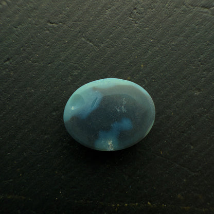 0.63 Black Opal With A Vivid Green-Orange Color Palette And Rare Ribbon Pattern