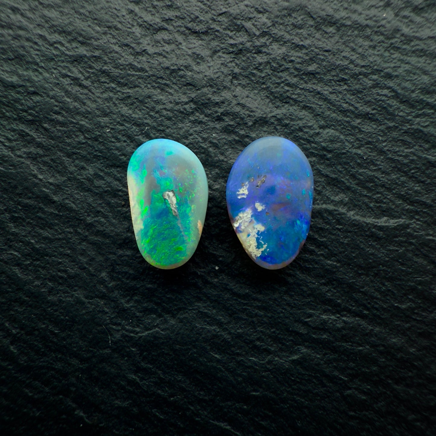 2.33ct Mismatched Pair (Price For Parcel) Black Opals With Blues And Greens And A Freeform Shape