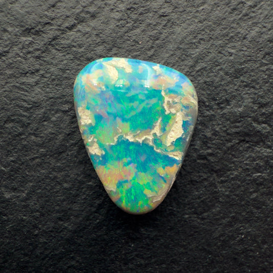 2.85ct Picture Stone Dark Opal With A Tropical Blue Green Color And Sandy colored Inclusions