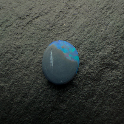 0.73cts Black Opals With Vivid Blue-Green Color Play And A Moss Pattern