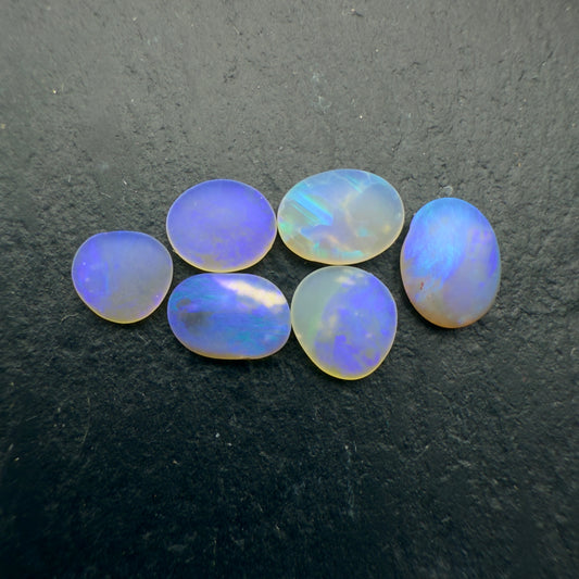 2.45ct Bundle (Price For Parcel) Matte finished opals with a soft purple glow