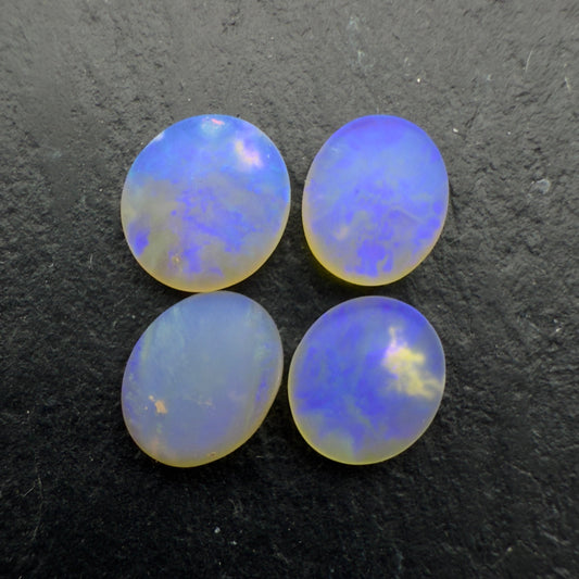2.2ct Bundle (Price For Parcel) Matte finished opals with a soft purple-green glow