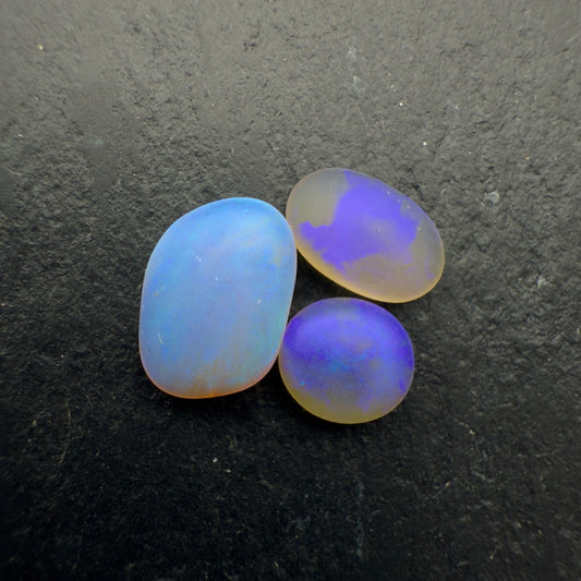 2.2ct Bundle (Price For Parcel) Matte finished opals with a soft purple-green glow