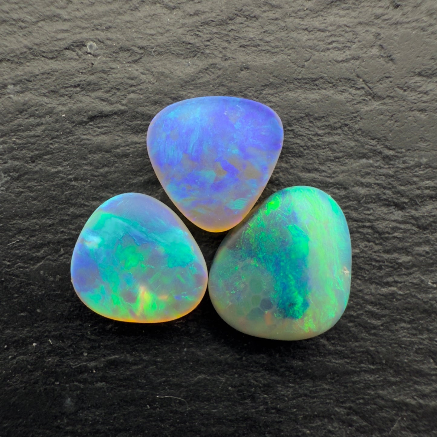 2.3ct Bundle (Price For Parcel) Matte finished opals with a soft purple-green glow