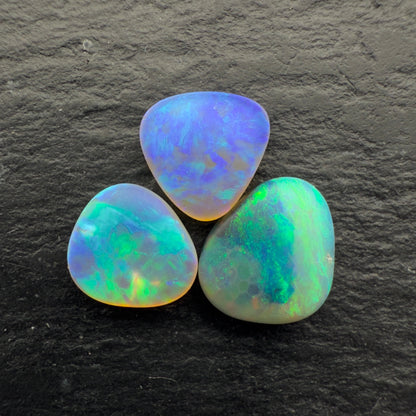 2.3ct Bundle (Price For Parcel) Matte finished opals with a soft purple-green glow