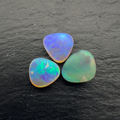 2.3ct Bundle (Price For Parcel) Matte finished opals with a soft purple-green glow