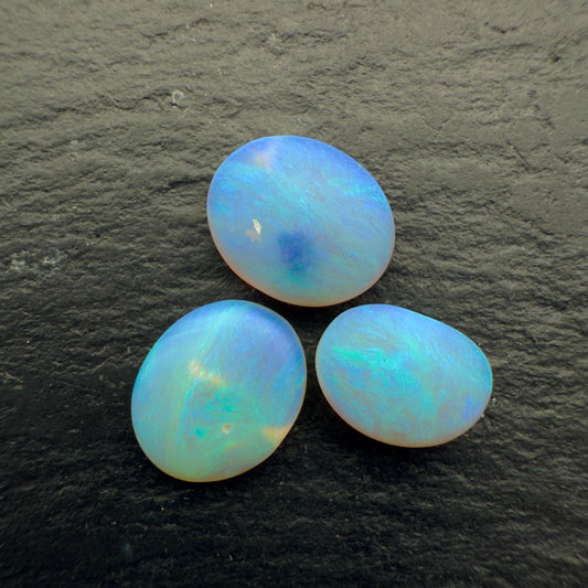 2.2ct Bundle (Price For Parcel) Matte finished opals with a soft purple-green glow