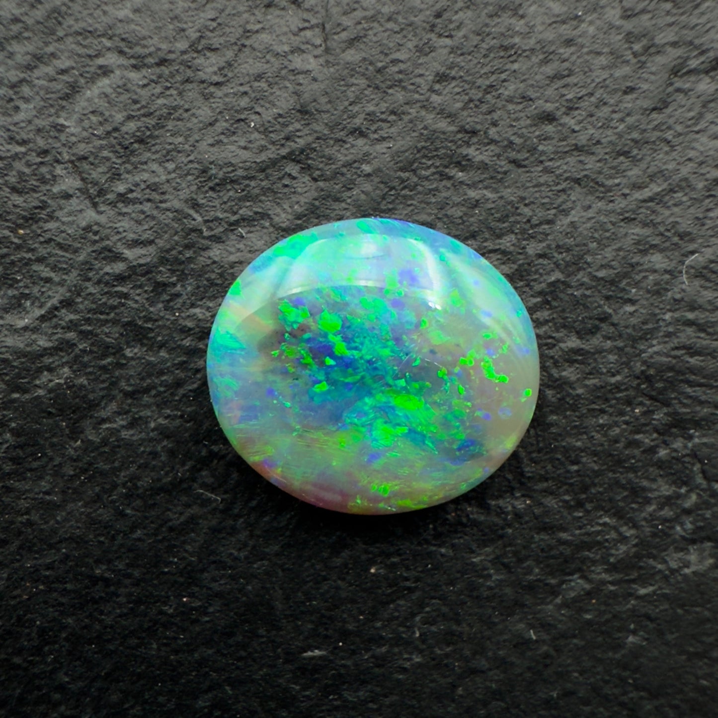 1.28cts Affordable Dark Opal With A Speckled Blue Green Pattern