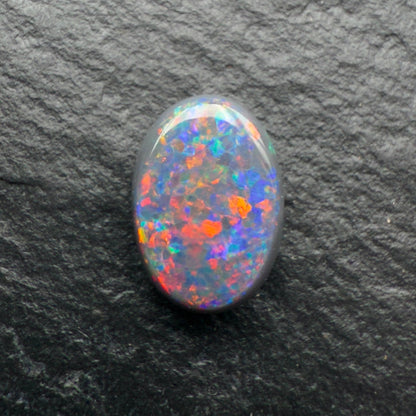 1.0ct Gem Black opal with A Beautiful Red-Blue Pinfire Pattern
