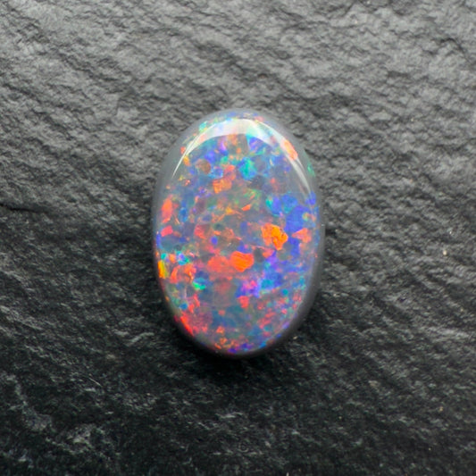 1.0ct Gem Black opal with A Beautiful Red-Blue Pinfire Pattern