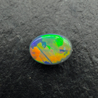 0.56cts Gem Black Opal With Vivid Multicolor And Rare Jigsaw Pattern