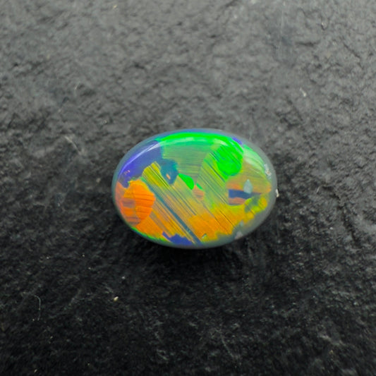 0.56cts Gem Black Opal With Vivid Multicolor And Rare Jigsaw Pattern