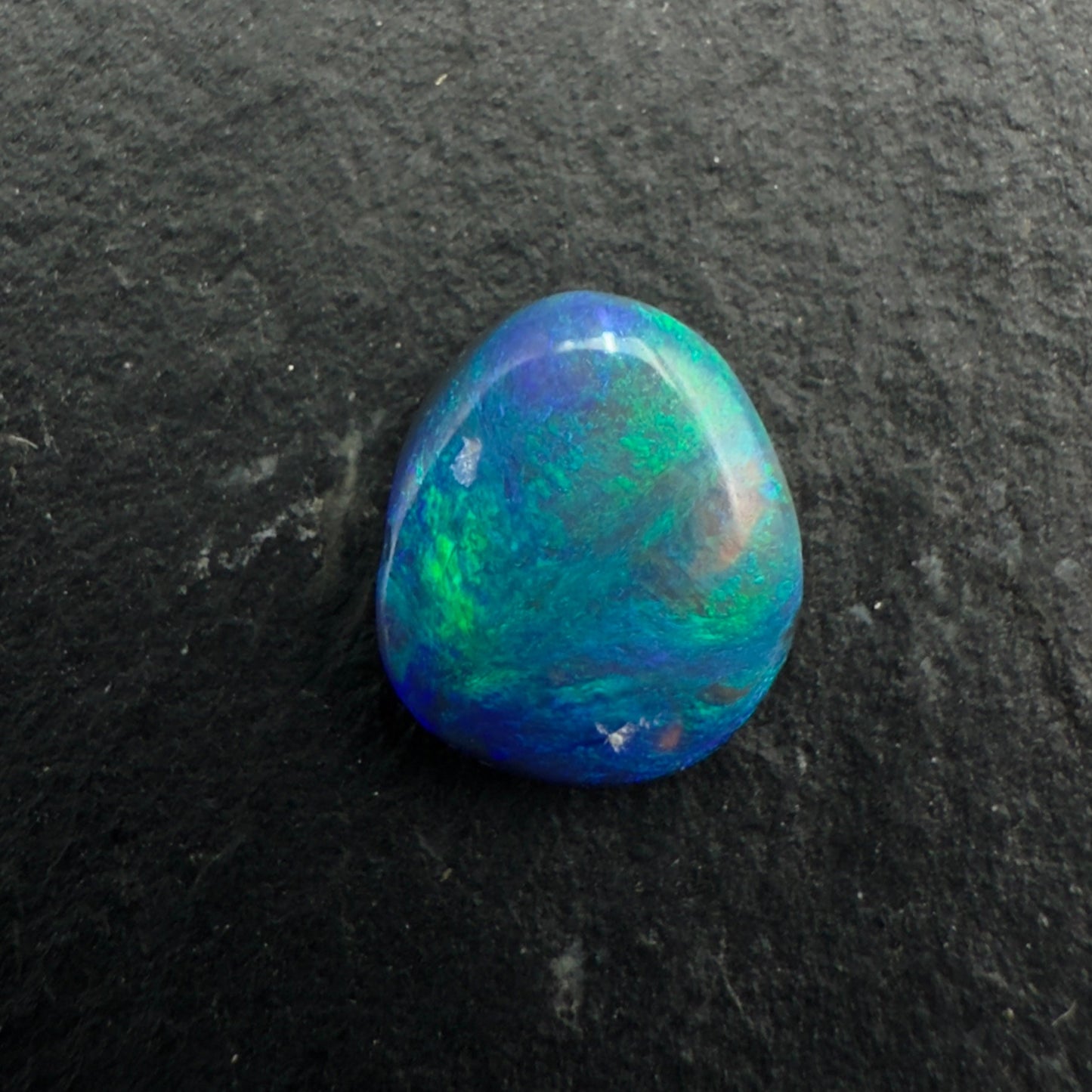 0.6ct Affordable Black Opal with Marbled Blues And Greens