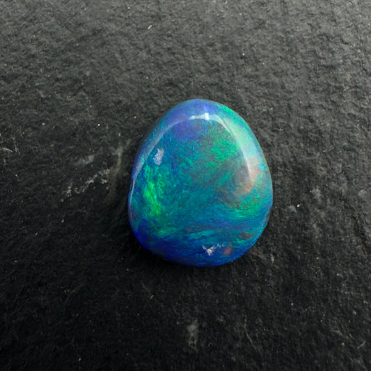 0.6ct Affordable Black Opal with Marbled Blues And Greens