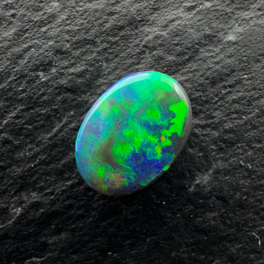 0.5cts Gem Black Opal With A Blocky Deep Green Blue Gold Pattern