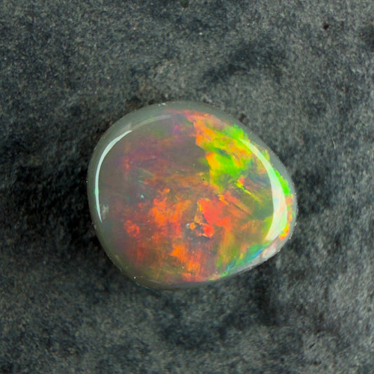 0.66cts Dark Opal With A Beautiful Mixed Red Pink Multicolor Pattern