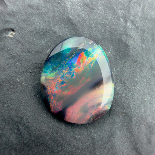 1.12cts Picture stone Black Opal With A Red Pink Multicolor Palette