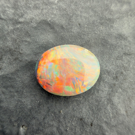 0.77cts Affordable Dark Opal With A Red Pink Multicolor Play of color