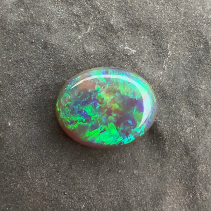 0.68cts Affordable Black Opal With A Green Blue Play Of Color, From Lightning Ridge Australia