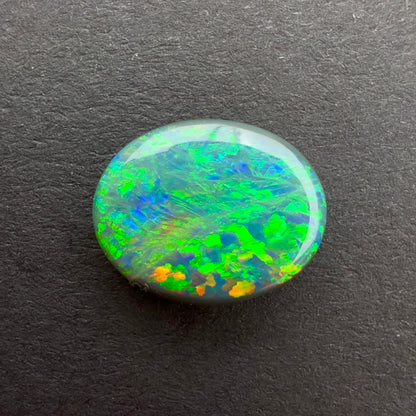 1.63cts Black Opal With A Green, Yellow, Gold Play Of Color, From Lightning Ridge Australia