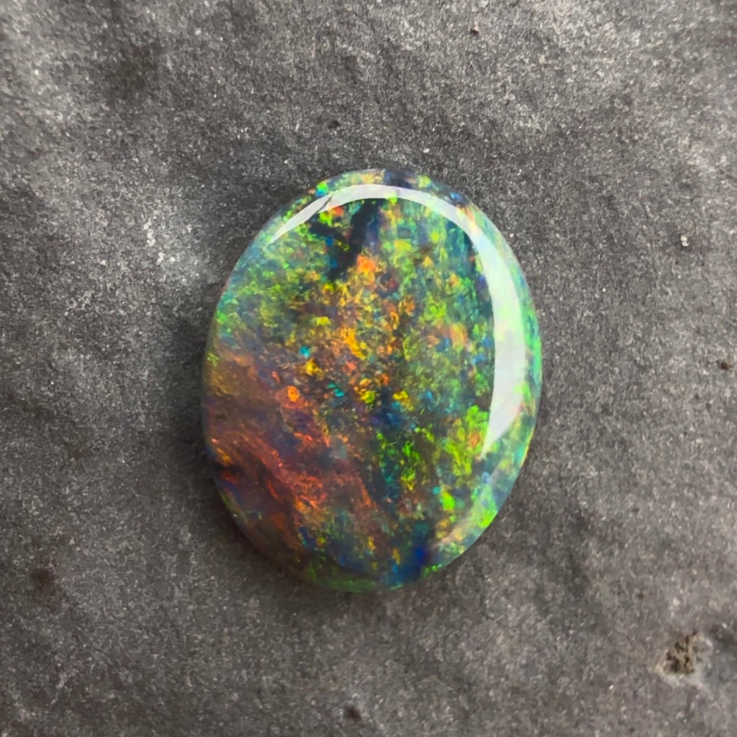 0.64cts Black Opal With A Red Multicolor Play Of Color, From Lightning Ridge Australia