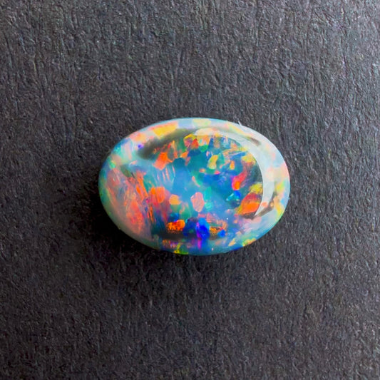 0.75cts Black Opal With A Red Pink Multicolor Play Of Color, From Lightning Ridge Australia