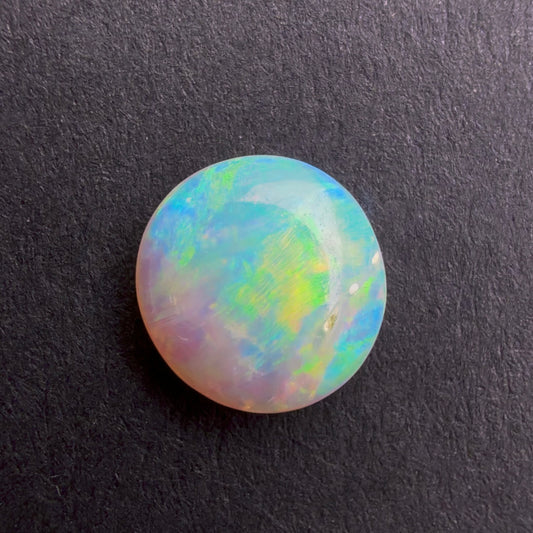 0.82cts Affordable Crystal Opal With A Blue Yellow Gold Play Of Color, From Lightning Ridge Australia