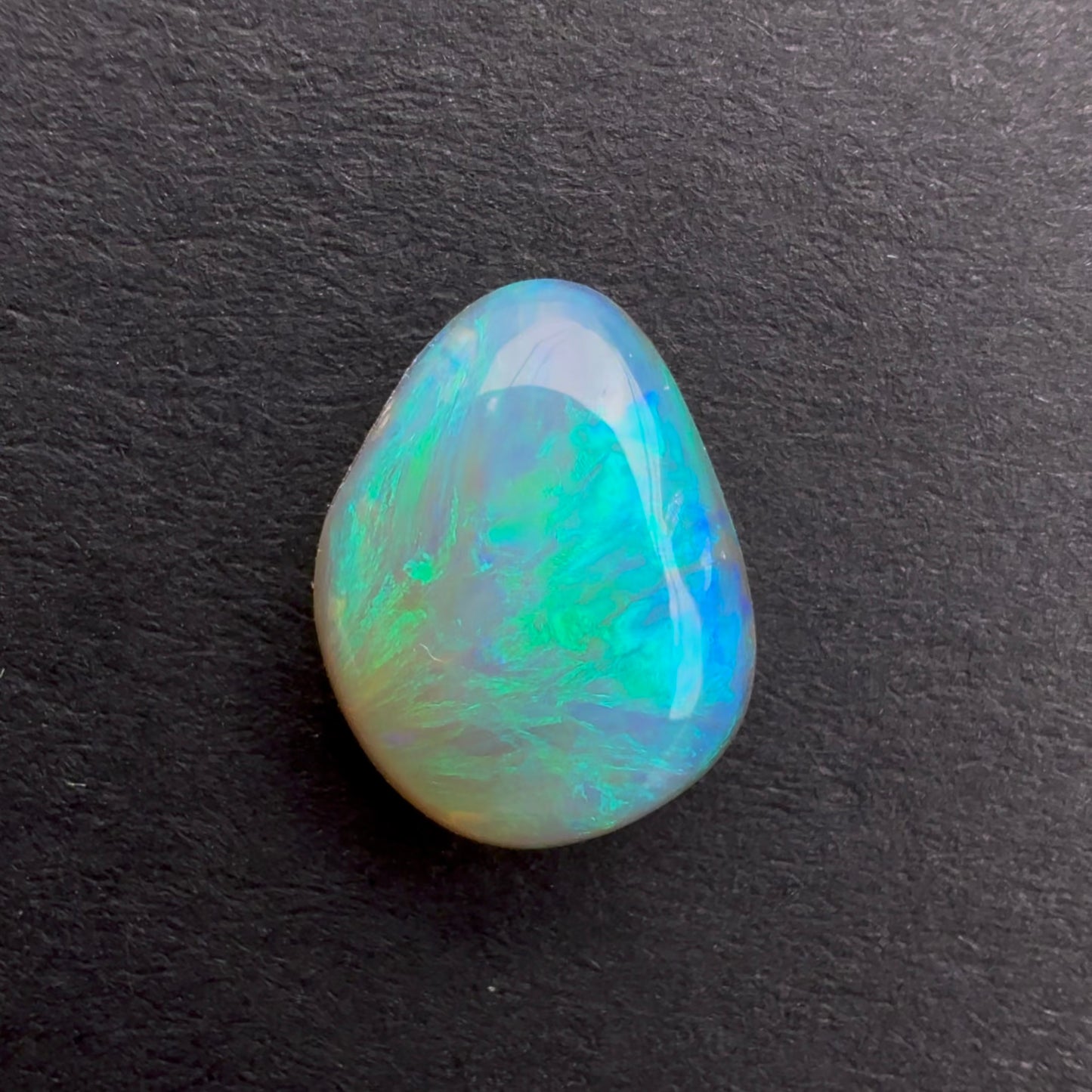 0.79cts Affordable Dark Crystal Opal With A Green Blue Play Of Color, From Lightning Ridge Australia