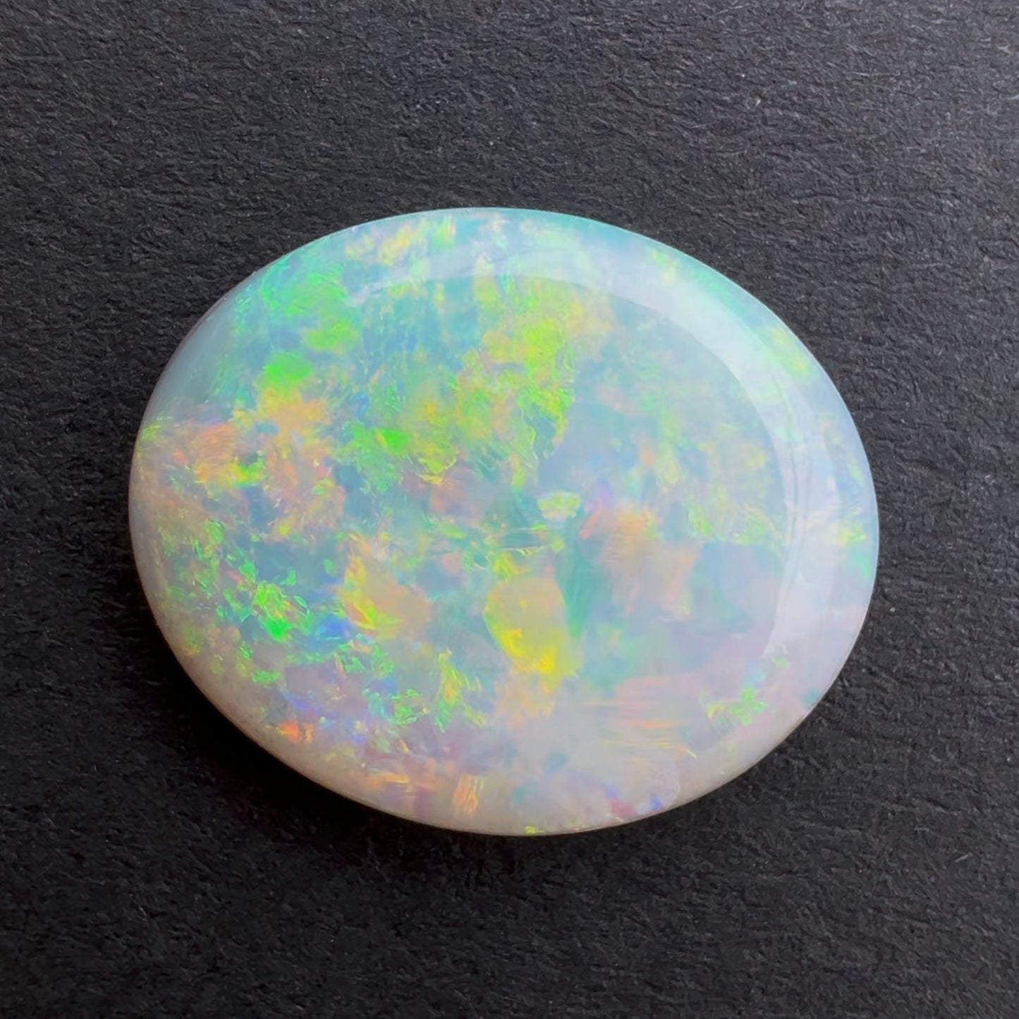 2.82cts Dark Crystal Opal With A Green, Yellow, Gold Play Of Color, From Lightning Ridge Australia