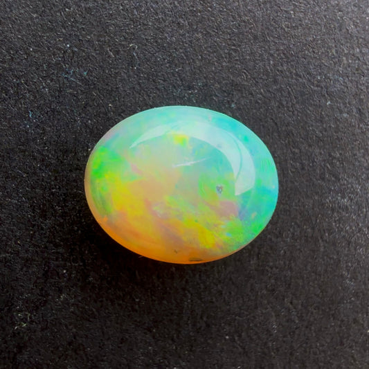 0.7cts Affordable Crystal Opal With A Green, Yellow, Gold Play Of Color, From Lightning Ridge Australia
