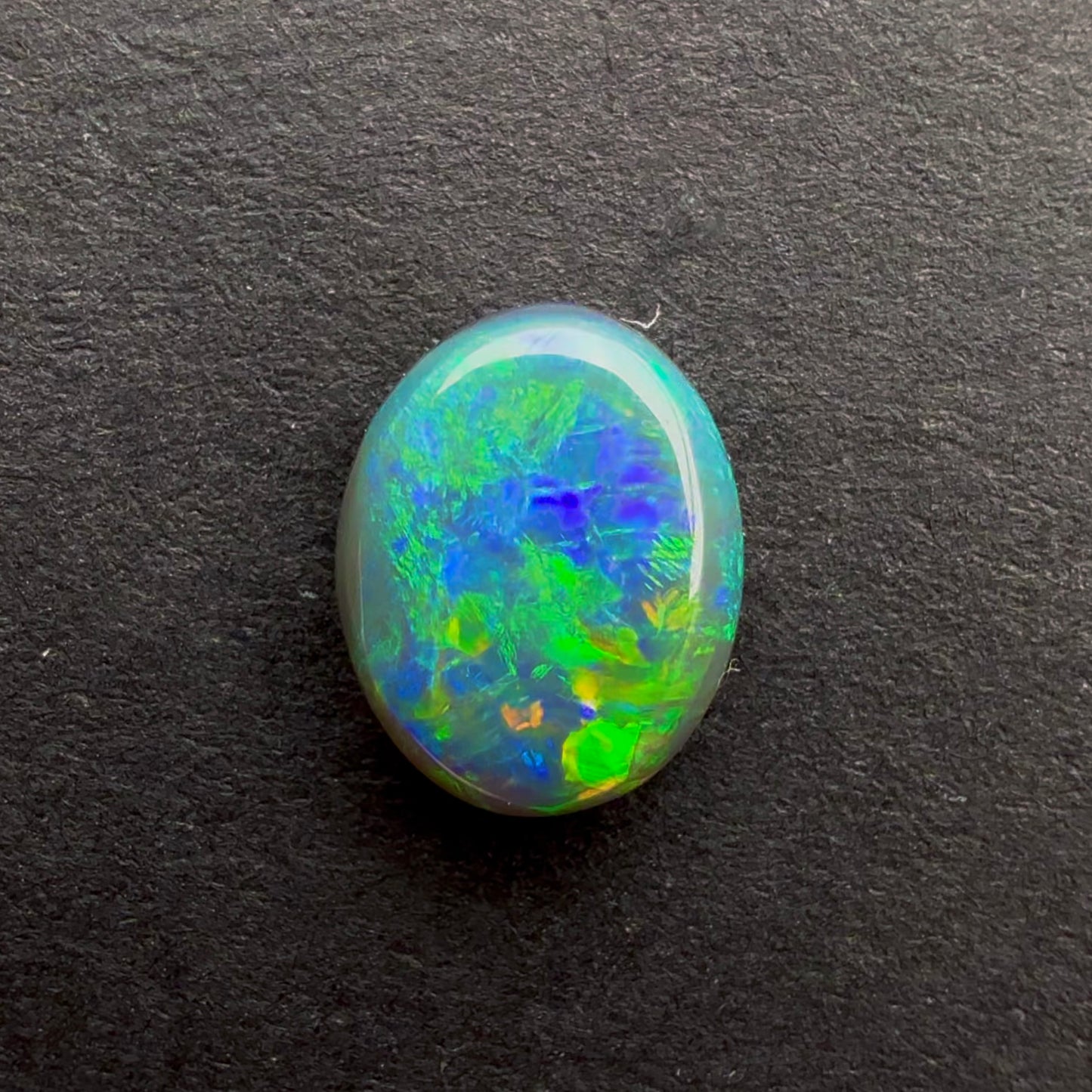0.58cts Affordable Black Opal With A Green Blue Play Of Color, From Lightning Ridge Australia