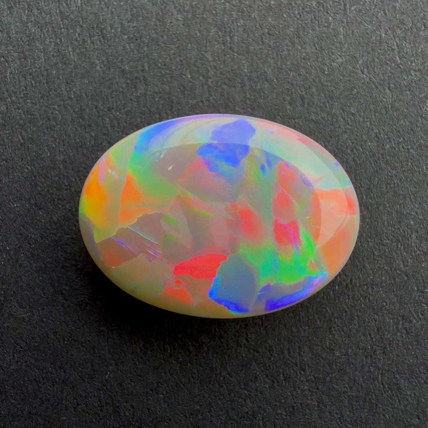 3cts Dark Opal With A Red Pink Multicolor Play Of Color, From Lightning Ridge Australia