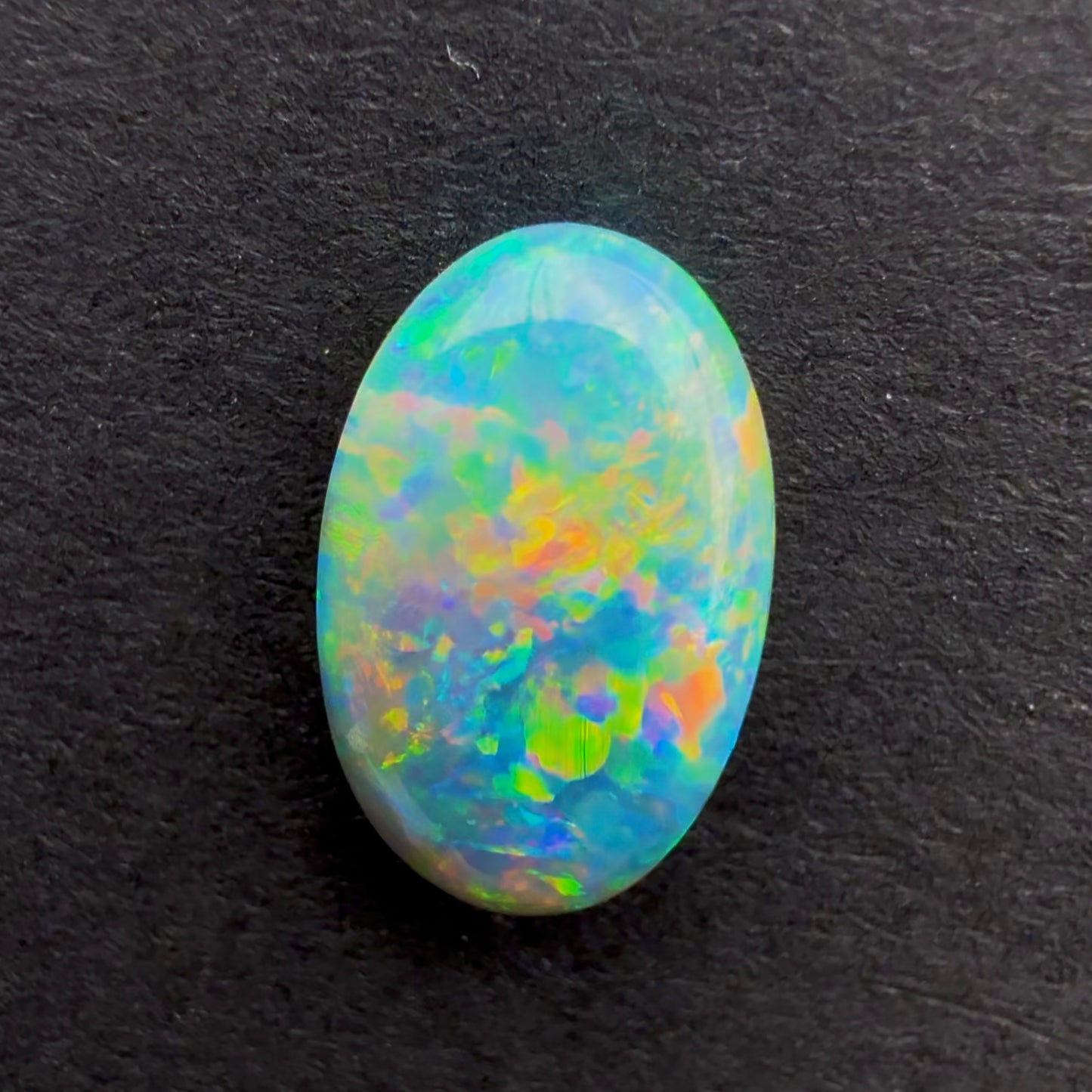 1cts Dark Crystal Opal With A Green Blue Multicolor Play Of Color, From Lightning Ridge Australia