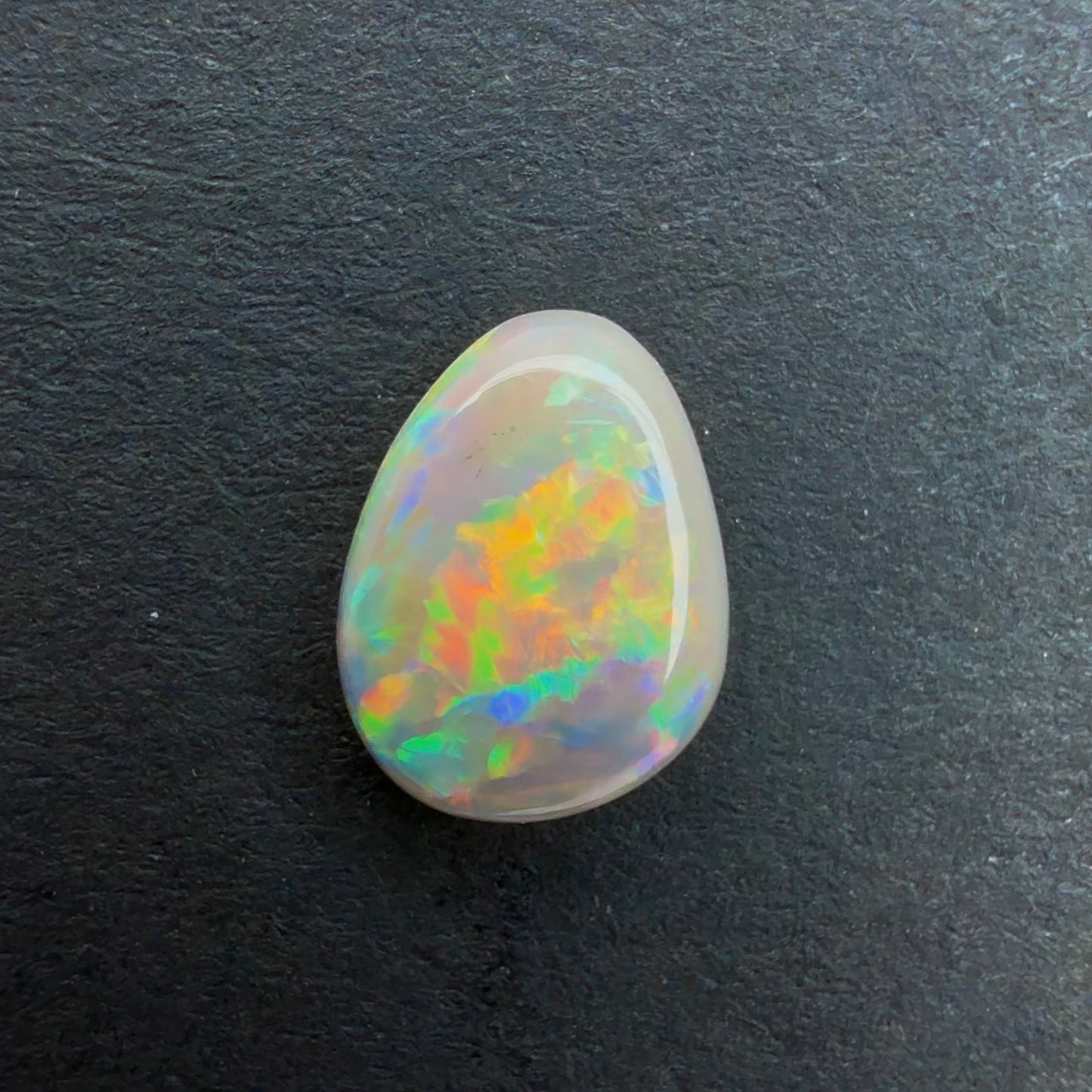 0.67cts Affordable Dark Crystal Opal With A Green, Yellow, Gold Multicolor Play Of Color, From Lightning Ridge Australia