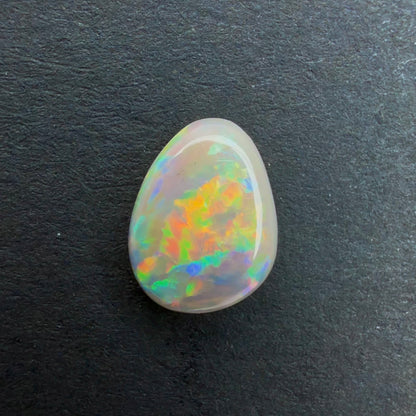 0.67cts Affordable Dark Crystal Opal With A Green, Yellow, Gold Multicolor Play Of Color, From Lightning Ridge Australia