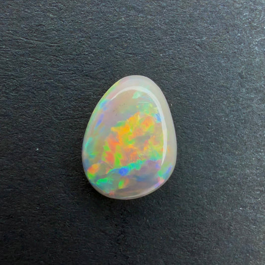 0.67cts Affordable Dark Crystal Opal With A Green, Yellow, Gold Multicolor Play Of Color, From Lightning Ridge Australia