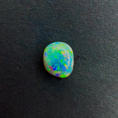 0.55cts Dark Crystal Opal With A Green Blue Multicolor Play Of Color, From Lightning Ridge Australia
