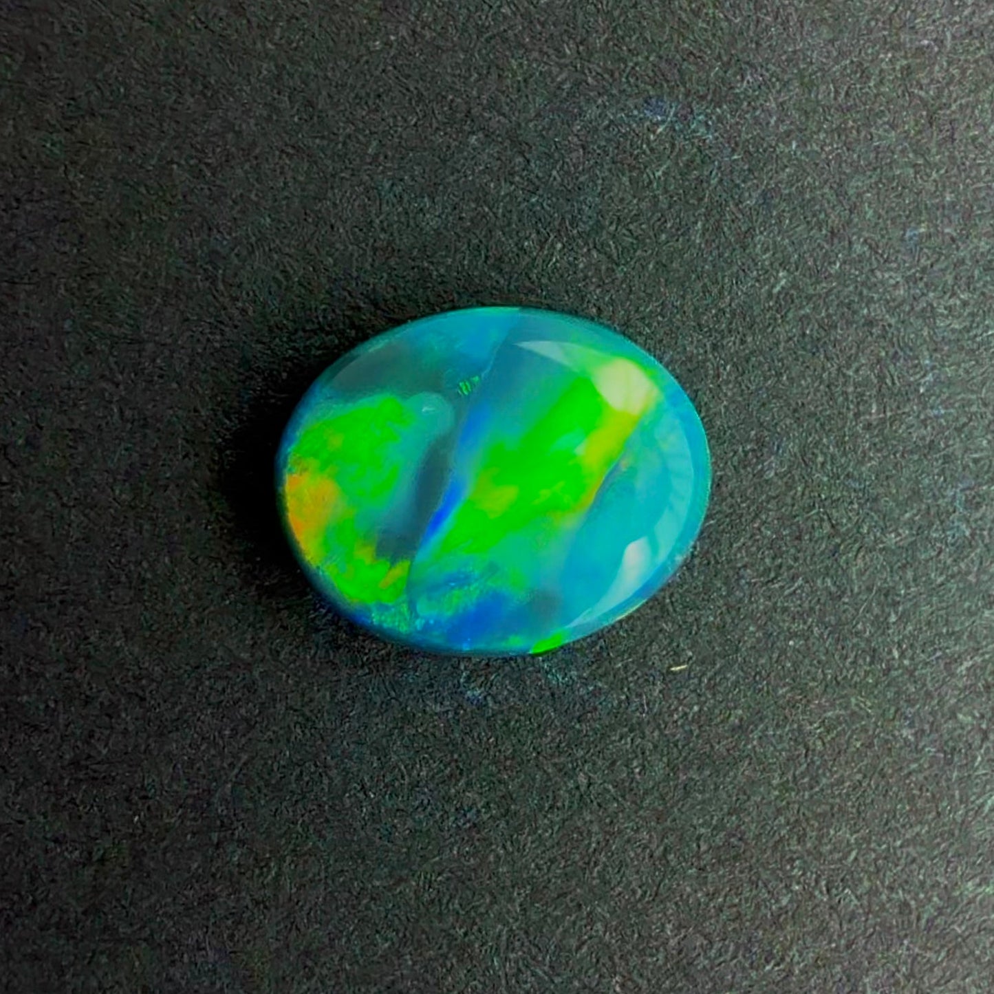 0.64cts Black Opal With A Green, Yellow, Gold Play Of Color, From Lightning Ridge Australia