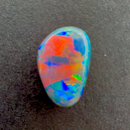 0.73cts Black Opal With A Red Pink Multicolor Play Of Color, From Lightning Ridge Australia