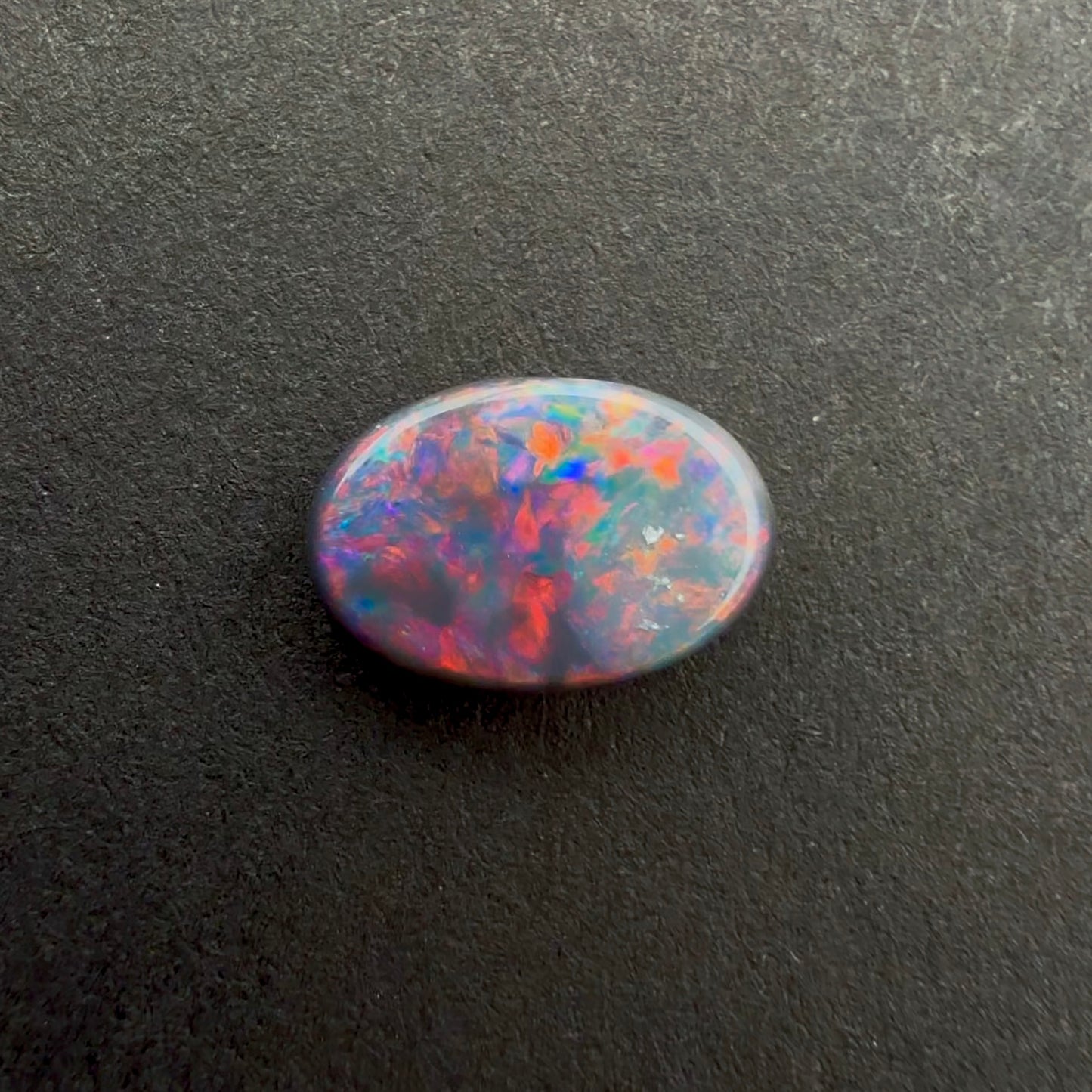 0.58cts Dark Opal With A Red Pink Multicolor Play Of Color, From Lightning Ridge Australia