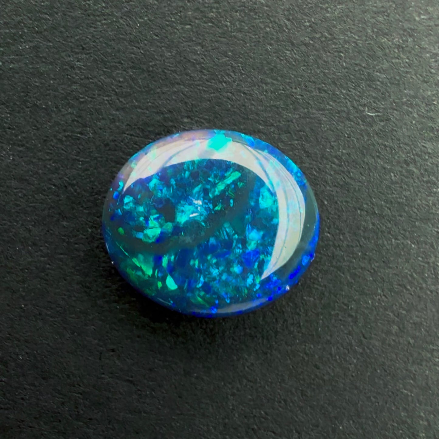 0.87cts Black Opal With A Dark Blue Green Play Of Color, From Lightning Ridge Australia
