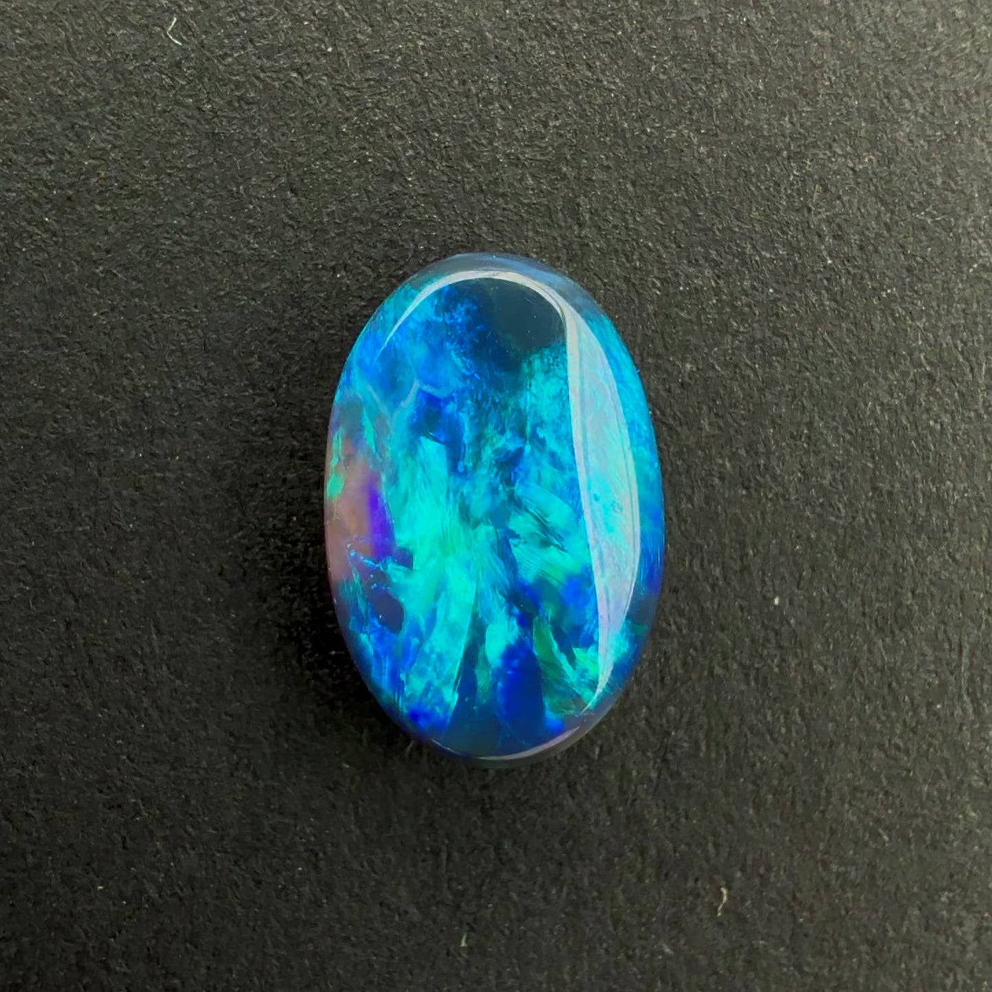 0.71cts Black Opal With A Dark Blue Green Play Of Color, From Lightning Ridge Australia