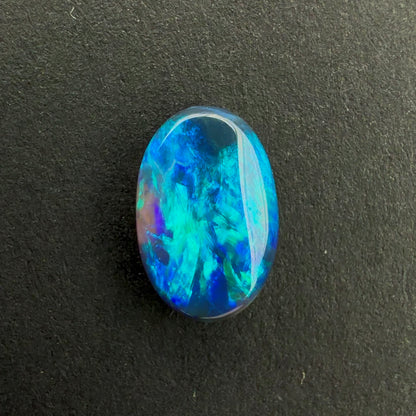 0.71cts Black Opal With A Dark Blue Green Play Of Color, From Lightning Ridge Australia