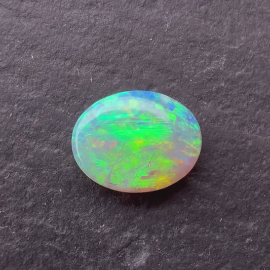 0.76ct Crystal Opal With A Red, Pink Multicolor Play Of Color, From Lightning Ridge Australia