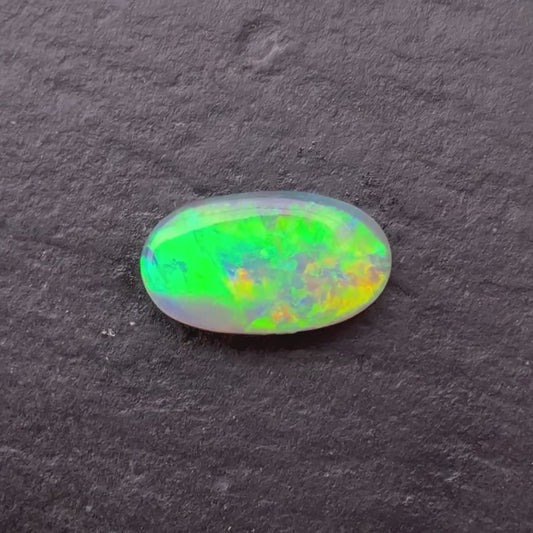 0.58ct Crystal Opal With A Green, Yellow, Gold Play Of Color, From Lightning Ridge Australia