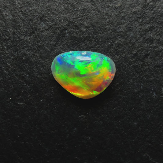 0.58ct World Class Crystal Opal, This Gem Has A Brilliant Orange To Green Color Transition Across The stone.