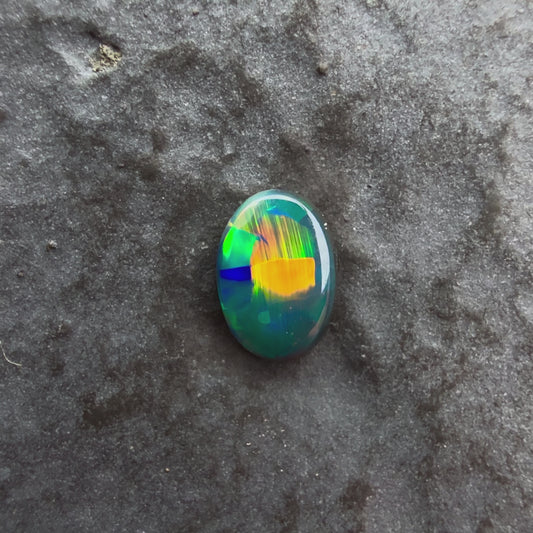 6mm x 4mm Top Quality Black Opal With Green, Yellow, Gold Play Of Color, From Lightning Ridge Australia